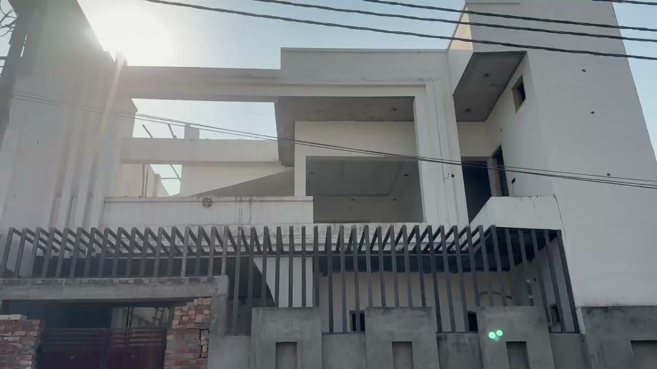 Our own footage of this build mid-construction, structural framing and facade detail